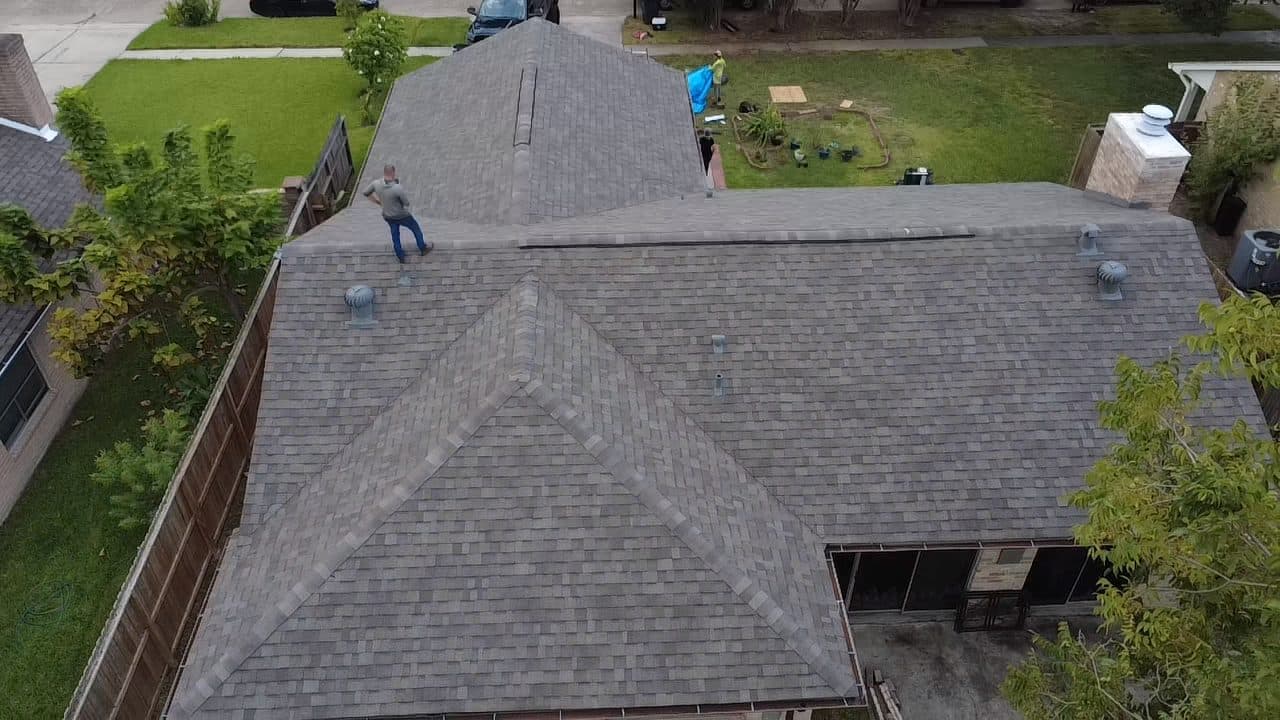 Aerial view of a completed roof replacement by Tex-Mex Roofing in north Houston, Texas