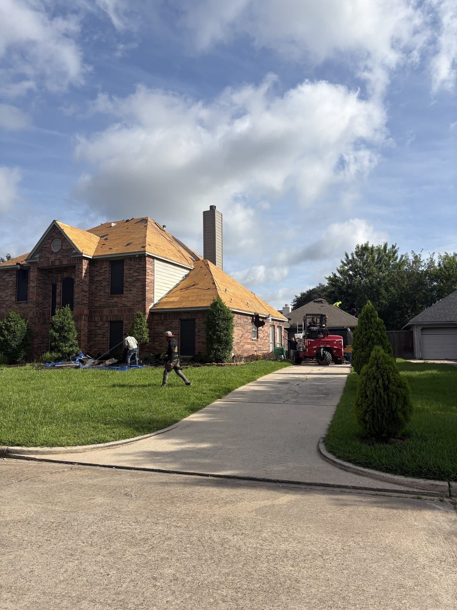 Roof stripped to fresh decking and ready for underlayment on a brick home in north Houston